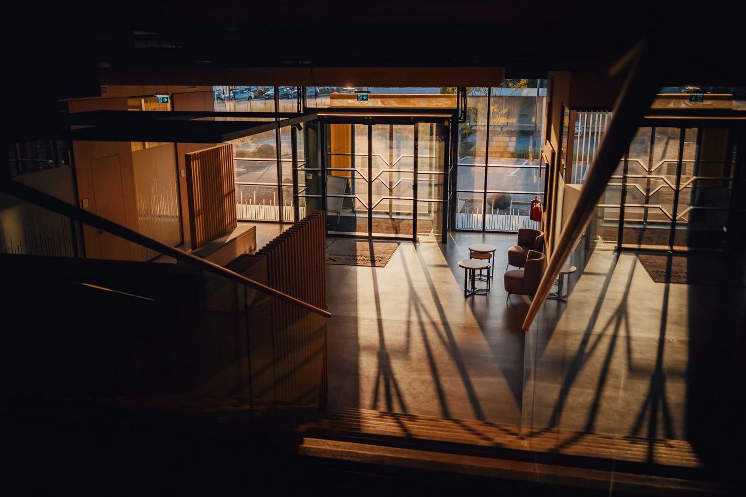 Sunlit hotel entrance at Bonuscanvas Hotel
